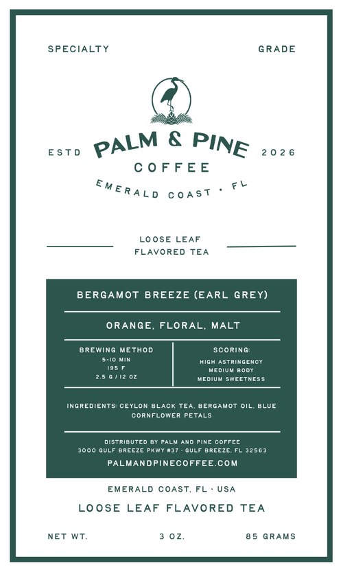 A flat product label for Palm & Pine Coffee's Emerald Coast 2026 Loose Leaf Flavored Tea. The label features a white background with dark green text and a dark green central box detailing the tea's characteristics, including Bergamot Breeze (Earl Grey), orange, floral, and malt notes.