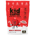 A 2.75 oz bag of kiÿd Coffee Minty Mocha instant coffee with nutrition, featuring a red and white package design with a cartoon red coffee cup character and product details.