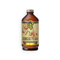 A bottle of Georgia Peach Premium Beverage Concentrate on a plain white background. The product is in an amber glass bottle with a cream-colored label featuring illustrations of peaches and a gold cap.
