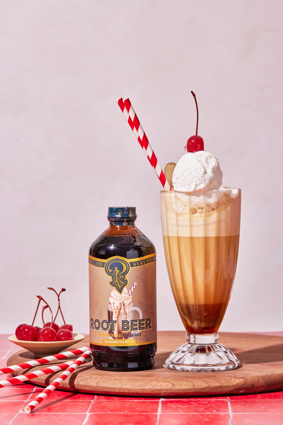 Root beer bottle with a root beer float on a wooden board.