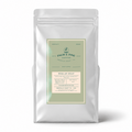 A silver stand-up coffee bag with a front label reading Palm & Pine Coffee Decaf Espresso, photographed on a clean white background with a soft shadow.