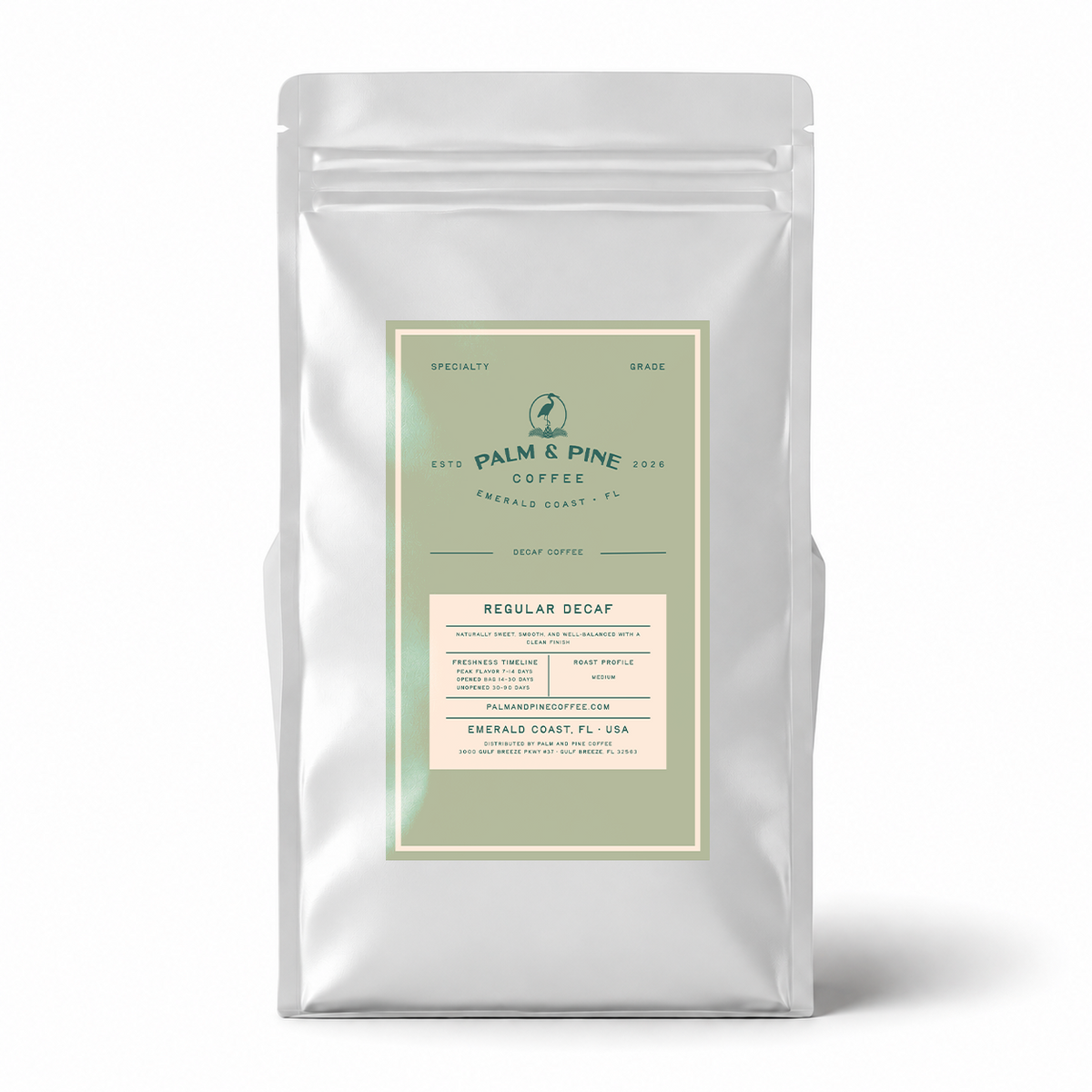 A silver stand-up coffee bag with a front label reading Palm & Pine Coffee Decaf Espresso, photographed on a clean white background with a soft shadow.