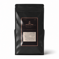 A black stand-up coffee bag with a rectangular front label reading Palm & Pine Coffee, photographed on a clean white background with a soft shadow.