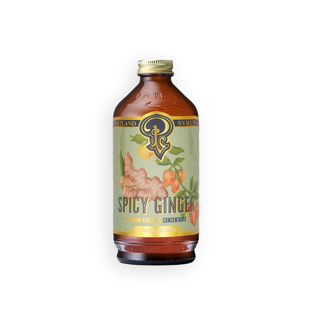 A bottle of Oakland Spicy Ginger Syrup Concentrate with a light green label featuring ginger root illustrations, set against a plain white background.